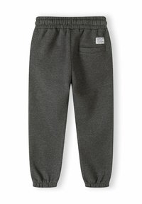Graue Jogginghose mit elastischem Bund, schmal zulaufenden Knöcheln und einer Gesäßtasche. Hergestellt aus weichem Material, mit einem Etikett am Bund.