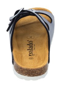 Infradito nero e beige con design aperto, dotate di una soletta in sughero, cinturini in suede e suola in gomma bianca. Branding "Palado" all'interno.