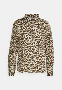 Chemise à boutons imprimée léopard en crème, avec des taches brunes et noires, manches longues, col et coupe droite.