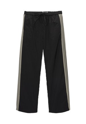 Zwarte losse trainingsbroek met witte zijstrepen en een elastische tailleband met voorstrik.