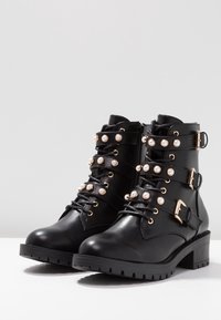 Bianco Bottines de cowboy / motard - black