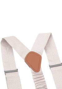 Verstellbare Baumwollträger in hellbeige mit einem strukturierten Diamantmuster. Mit braunen Lederakkzenten und Metallclips zur Befestigung.