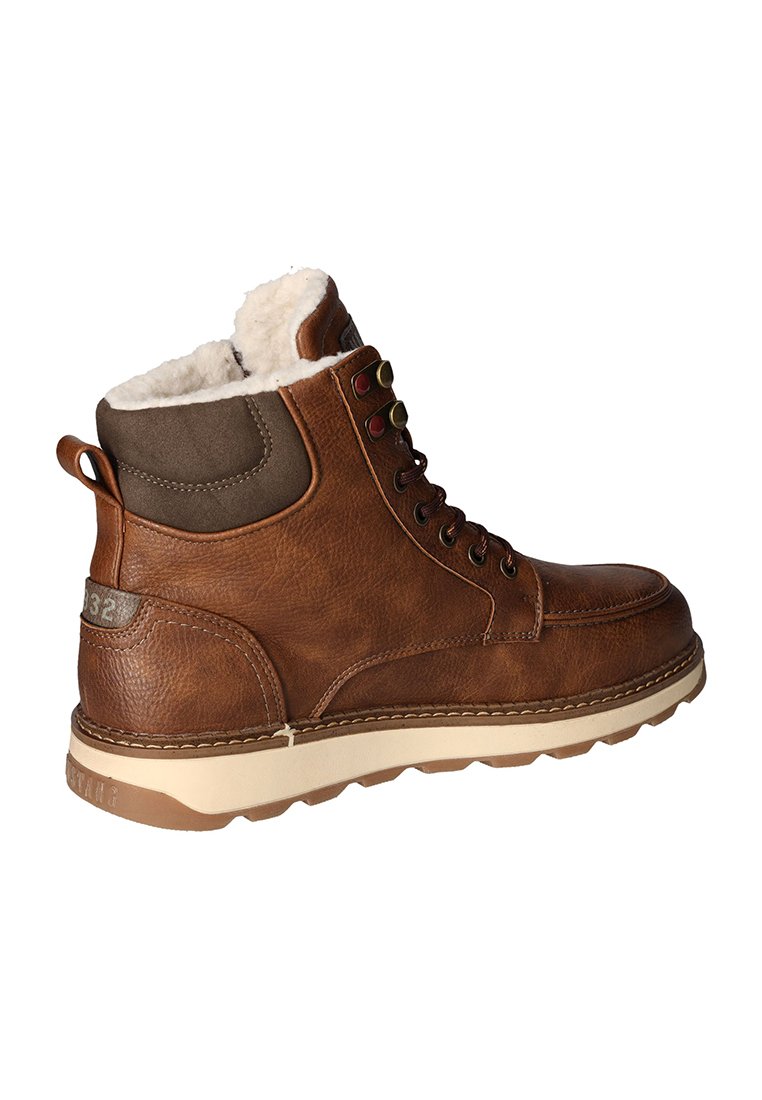 Braune Leder-Ankle-Boots mit einem gepolsterten braunen Kragen und einem weichen weißen Innenfutter, ausgestattet mit Metallösen und einer massiven beigefarbenen Sohle.
