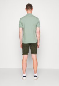 Lacoste Polo majica - light green melange
