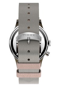 Hallide hallituskellari rihm roosa aktsendiga, roostevaba terasest riistvara ja nähtavad reguleerimishauke. Brändi nimi "Timex" on graveeritud kinnitusele.