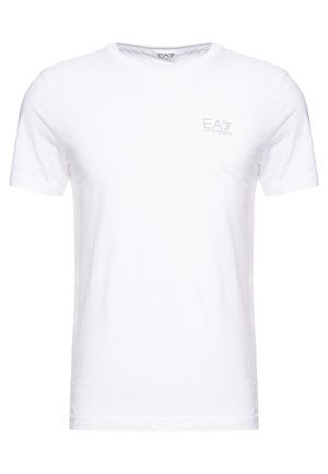 Bela bombažna majica s kratkimi rokavi, okroglo izrezana in z majhnim logotipom EA7 v svetlo sivi barvi natisnjenim na prsih.
