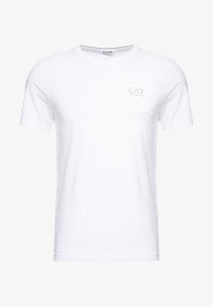 Bijela pamučna majica kratkih rukava s okruglim izrezom i malim EA7 logotipom ispisanim svijetlo sivom bojom na prsima.