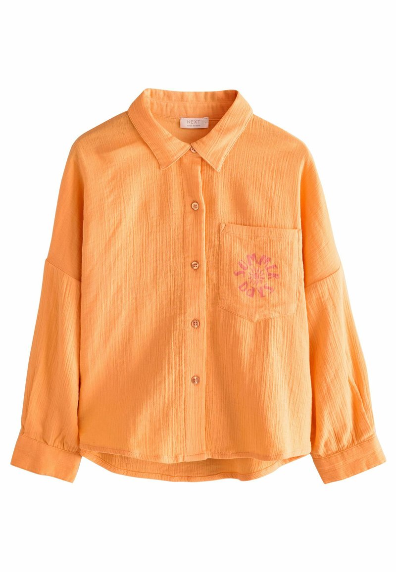 Oranges, strukturiertes Hemd mit Knopfleiste und Kragen, einer einzelnen Brusttasche und floralem Stickdetail. Weicher Stoff, lockere Passform.