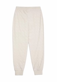 Ljust beiga sweatpants med en mjuk textur, elastisk midja och subtilt övergripande logomönster. Bälgar vid anklarna fulländar designen.