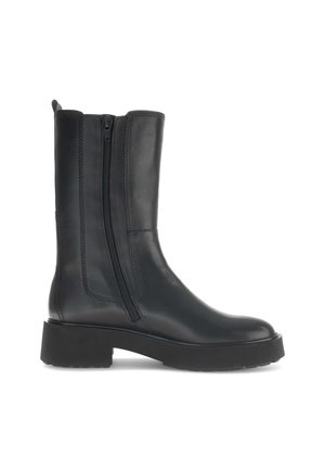 Black leather ankle boot with a side zipper, rounded toe, and thick rubber sole. Features stitching detail along the edges.
