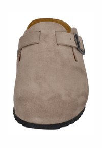 Beige suede slip-on clog with adjustable side buckle and black sole, viewed from the front.
