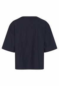 Navy blue short-sleeve top made of cotton, featuring a straight cut, wide neckline, and subtle back pleats for added texture.