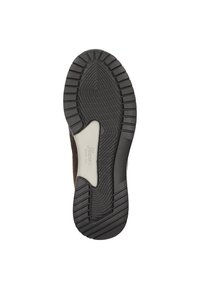 Semelle de chaussure en caoutchouc noir texturé avec des rainures profondes pour l'adhérence, et un accent synthétique lisse au centre.
