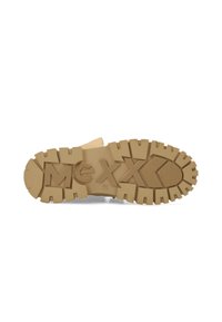 Suole in gomma con scanalature profonde; colore beige; presenta il marchio "meXXo" in rilievo per trazione e identificazione del brand.
