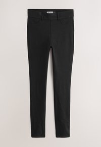 Leggings negros ajustados con pasadores para cinturón, bolsillos delanteros y traseros, colocados planos sobre un fondo claro.