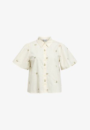 Blouse crème à manches courtes avec de petites imprimés floraux roses, boutonnée à l'avant et col pointu.