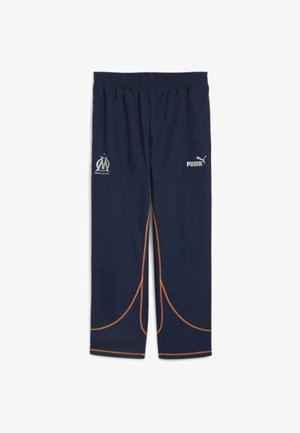 Navy athletic pants with an elastic waistband, featuring silver logos for Marseille and Puma, accented with orange stitching and curved design lines.