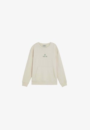 Sudadera de manga larga color crema con bolsillo frontal y una pequeña calavera verde junto a texto en japonés centrados en el pecho.