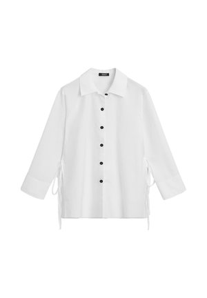 White button-up shirt with a collar, featuring black buttons down the front and ties on the sides. Lightweight fabric, long sleeves.