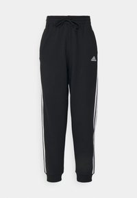 Černé adidas sportovní kalhoty s bílými bočními pruhy, elastickým pasem s šňůrkou a logem Adidas na levém stehně.