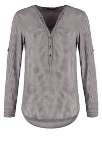 Blouse pour femme à manches longues avec petit motif géométrique, col en V avec trois boutons, et pattes de manche relevables dans des tons gris doux.