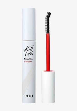 Tube blanc de dissolvant pour mascara Clio Kill Lash avec applicateur brosse incurvé à manche rouge à côté, sur fond uni.