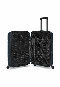 Valigia rigida di colore blu navy, con interno con zip foderato in tessuto nero, tasche in rete e cinghie incrociate per l'organizzazione.