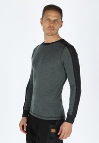 Long-sleeve shirt in gray with darker sleeves, made of soft fabric. Features a crew neck and fitted design, ideal for layering.
