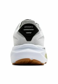 Brooks löparskor med en vit mesh-överdel, svart hälflik, luftig vit mellansula och en brun gummisul med accentdetaljer.