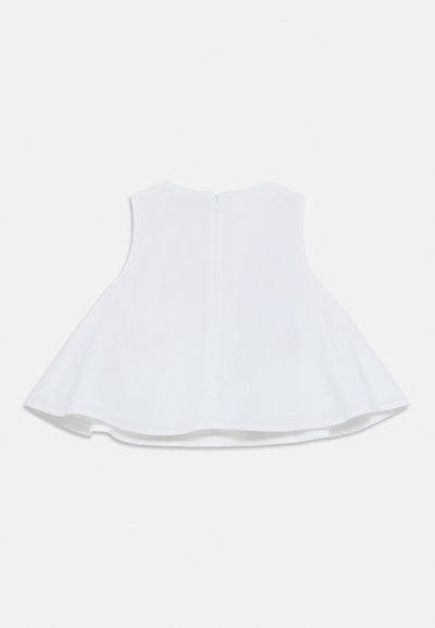 Λευκό αμάνικο τοπ με φαρδιά γραμμή, στρογγυλή λαιμόκοψη και κλείσιμο με φερμουάρ στην πλάτη. Κατασκευασμένο από λείο ύφασμα με καθαρό φινίρισμα.