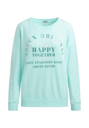 Mint green sweatshirt with long sleeves, relaxed fit, featuring graphic text designs in varying fonts in white and silver. Ribbed cuffs and hem.