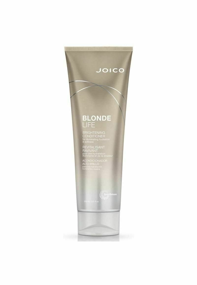 Joico Blonde Life Brightening Conditioner i en elegant silverrör med vit text, med en flip-top-locket och subtila böjda designaccent.