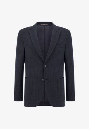 Jūras spēka zila herringbone stila žakete, kas izgatavota no teksturētas auduma, ar divām priekšējām kabatām, ar iegriezumiem pie apakšmalām un divām pogām. Veidota ar pielāgotu piegriezumu.