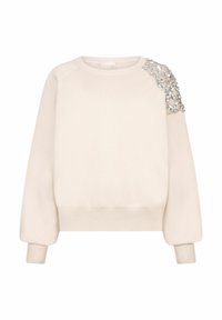 Hanorac bej cu decolteu rotund, mâneci raglan și un detaliu decorativ aplicat pe umărul stâng pentru accent.