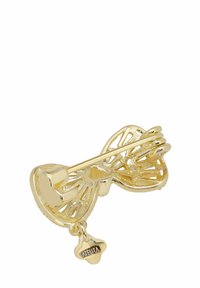 Gold-tone butterfly pin with intricate cut-out design and a small charm. The surface is shiny, adding a refined texture and detail.
