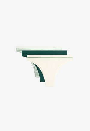 Trois culottes bikini pour femmes en blanc avec bordure verte, vert foncé uni, et blanc à rayures vertes, superposées sur un fond blanc.