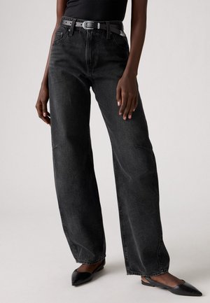 Wide-leg black denim jeans with a high waist, featuring a textured fabric, and a black belt with a silver buckle.