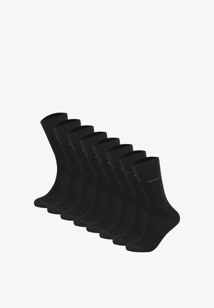 Sorte bomuldsstrømper vist i en række, med ribbestrikket kant og glat tekstur. Hver strømpe har minimal branding på siden.