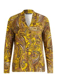 Blusa a maniche lunghe gialla con motivo paisley marrone e arancione. Presenta una scollatura a V e un tessuto morbido con un leggero luccichio.