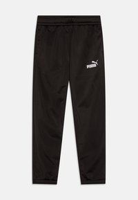 Pantalons de sport noirs en matériau lisse avec une taille élastique, arborant un logo Puma blanc sur le côté gauche.