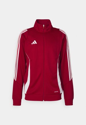 Red athletic jacket with a high collar, front zipper, white side stripes, and Adidas logo on the chest. Made from breathable material.