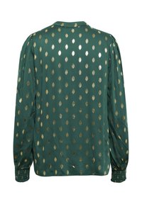 Blusa verde con un motivo a pois dorati, maniche arricciate, polsini elastici e colletto rotondo. Tessuto morbido e vestibilità rilassata.