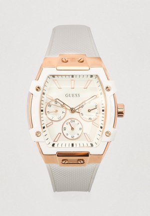 Witte siliconen horlogeband met een rosegouden roestvrijstalen kast, rechthoekige wijzerplaat, drie subdials en een gestructureerd wijzerplaatontwerp.