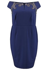 Námořnická modrá šaty bez ramínek s dekorativními korálky na výstřihu, obepnutý střih a délka ke kolenům. Hladká textura.