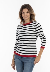 Maglione a maniche lunghe a righe con strisce bianche e nere, dettagli rossi sul collo e sui polsini, realizzato in un tessuto morbido e confortevole.