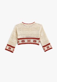 Sweter krótkie kroju w stylu szydełkowym, w kolorze kremowym z czerwonymi akcentami. Posiada otwarty splot, kwiatowe wzory na dolnym brzegu i rękawach oraz falowane krawędzie.