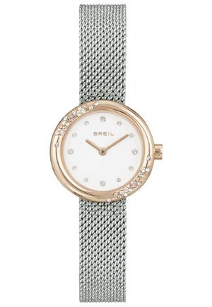 Ura z meshnato srebrno zapestnico, okroglo belo številčnico, rožnato zlato obrobo, kristalne oznake ur ter okrasne kristale na obrobi, blagovna znamka Breil.
