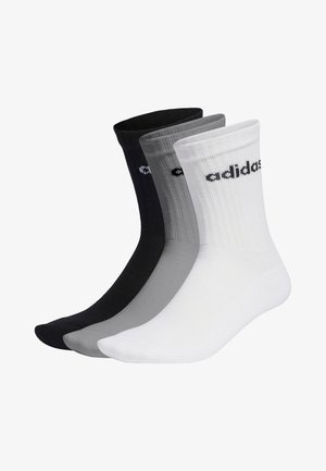 Drei Paar Adidas-Socken in Schwarz, Grau und Weiß. Hergestellt aus geripptem Stoff, verfügt jedes Paar über das Adidas-Logo in kontrastierender Farbe am Bund.