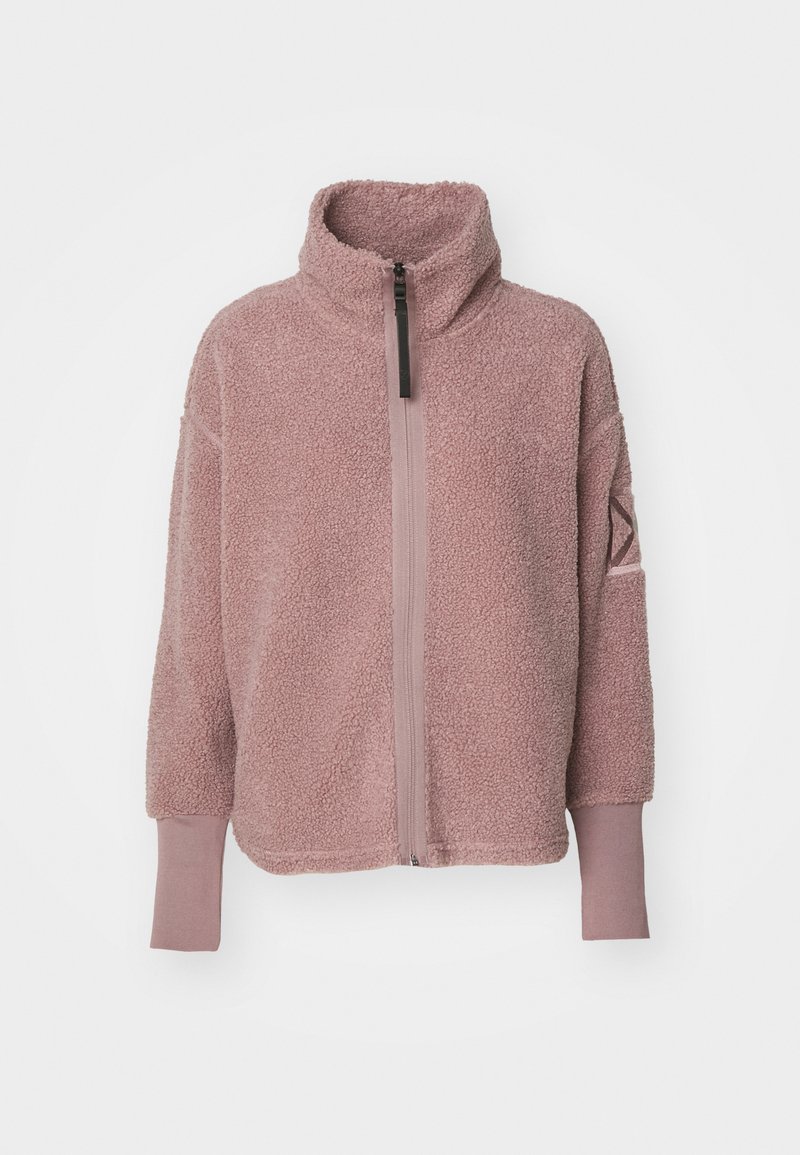 Fleece-Jacke in zartem Lichtrosa mit hohem Kragen, halbem Reißverschluss vorne und gerippten Bündchen. Mit einem dezenten Logodetail am Ärmel.