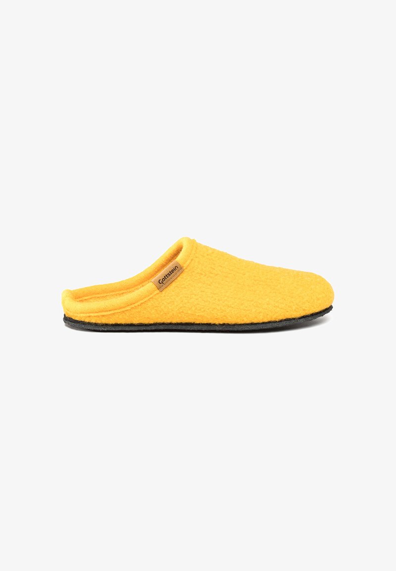 Yellow slip-on slipper with soft textured fabric, black sole, and small brown label on side reading "Gottstein" against white background.